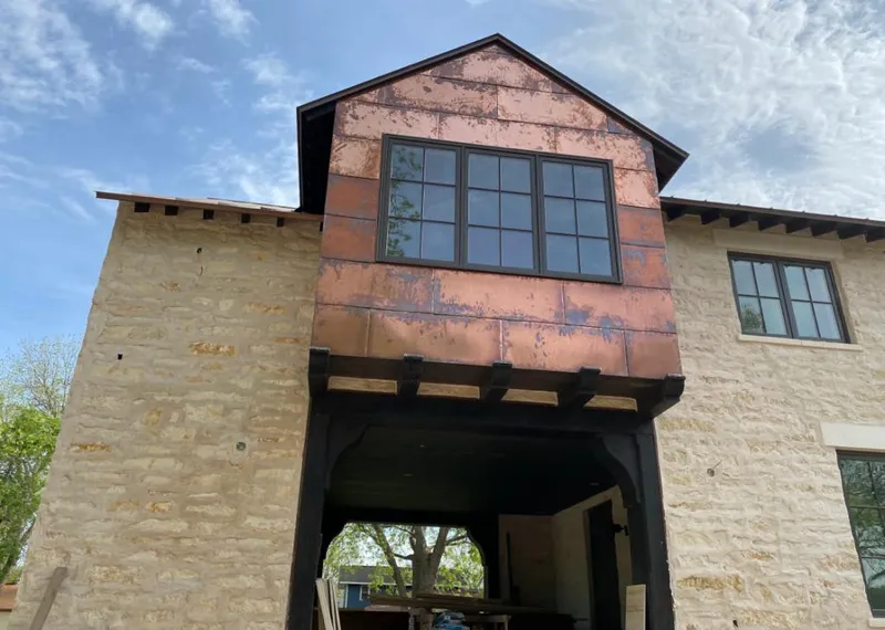 Copper metal panel facade on a stone building for Metal Roof Coating in Avon Lake