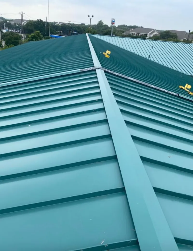 Green commercial metal roof ridge and valley for Metal Roof Repair in Avon Lake